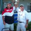 Norris brothers hold up the 20th anniversary cup